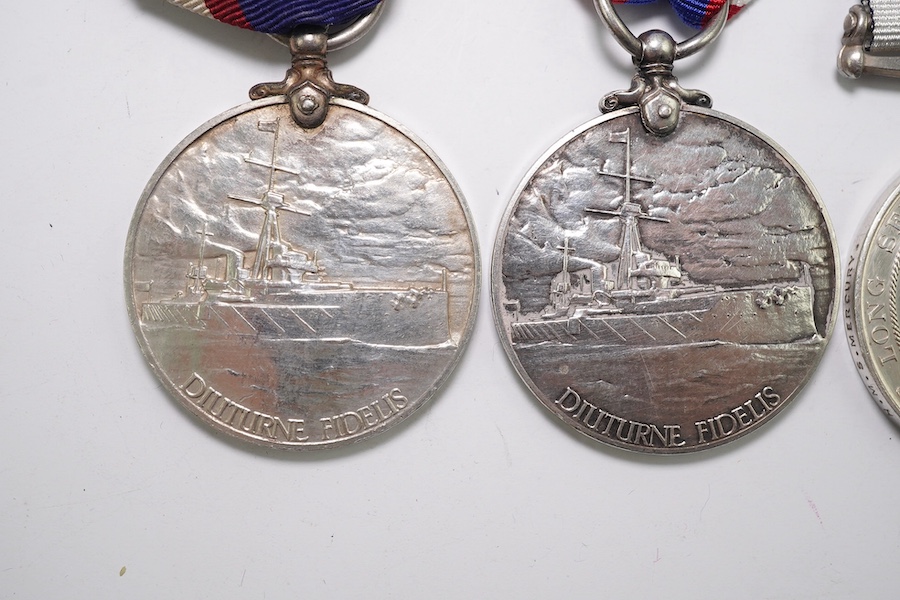 Four assorted Naval service medals; EVII RNRLSGC to 84333 G.Mitchell, Sea'n. 1CL. R.N.R.; GV RFRLSGC to J.99193 (Dev.B.15185) J.M.Dougall. A.B.R.F.R.; ERII RFRLSGC to SSSx.27156 J.W.Hopkins. Dev.B.17913.A.B. R.F.R; ERII